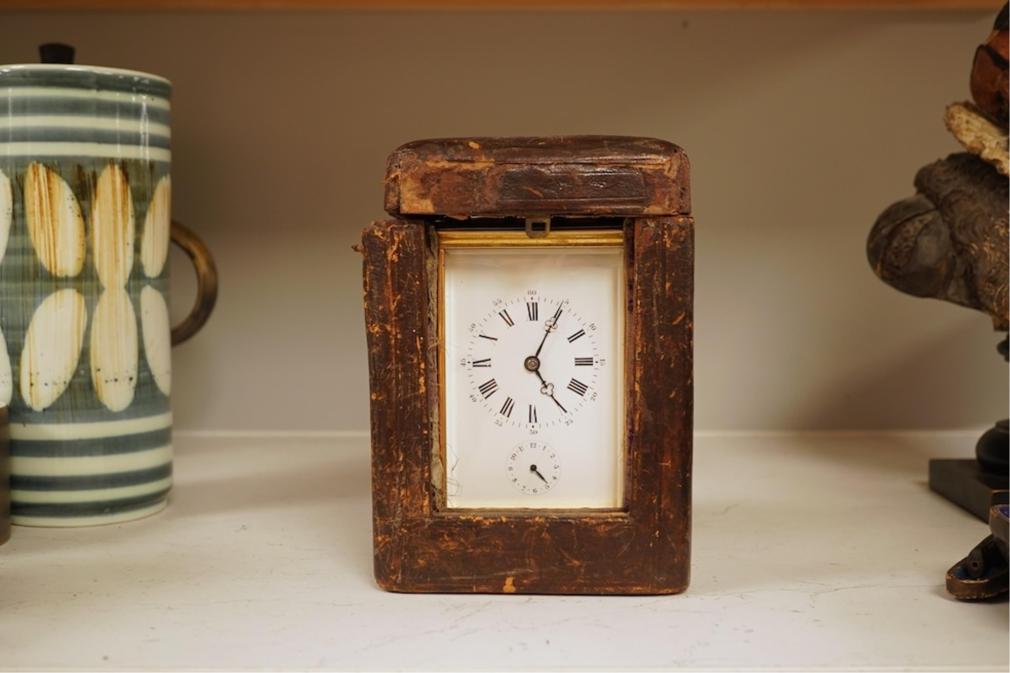 A French carriage clock with alarm, gong-striking movement, in a contemporary leather case, 17cm high